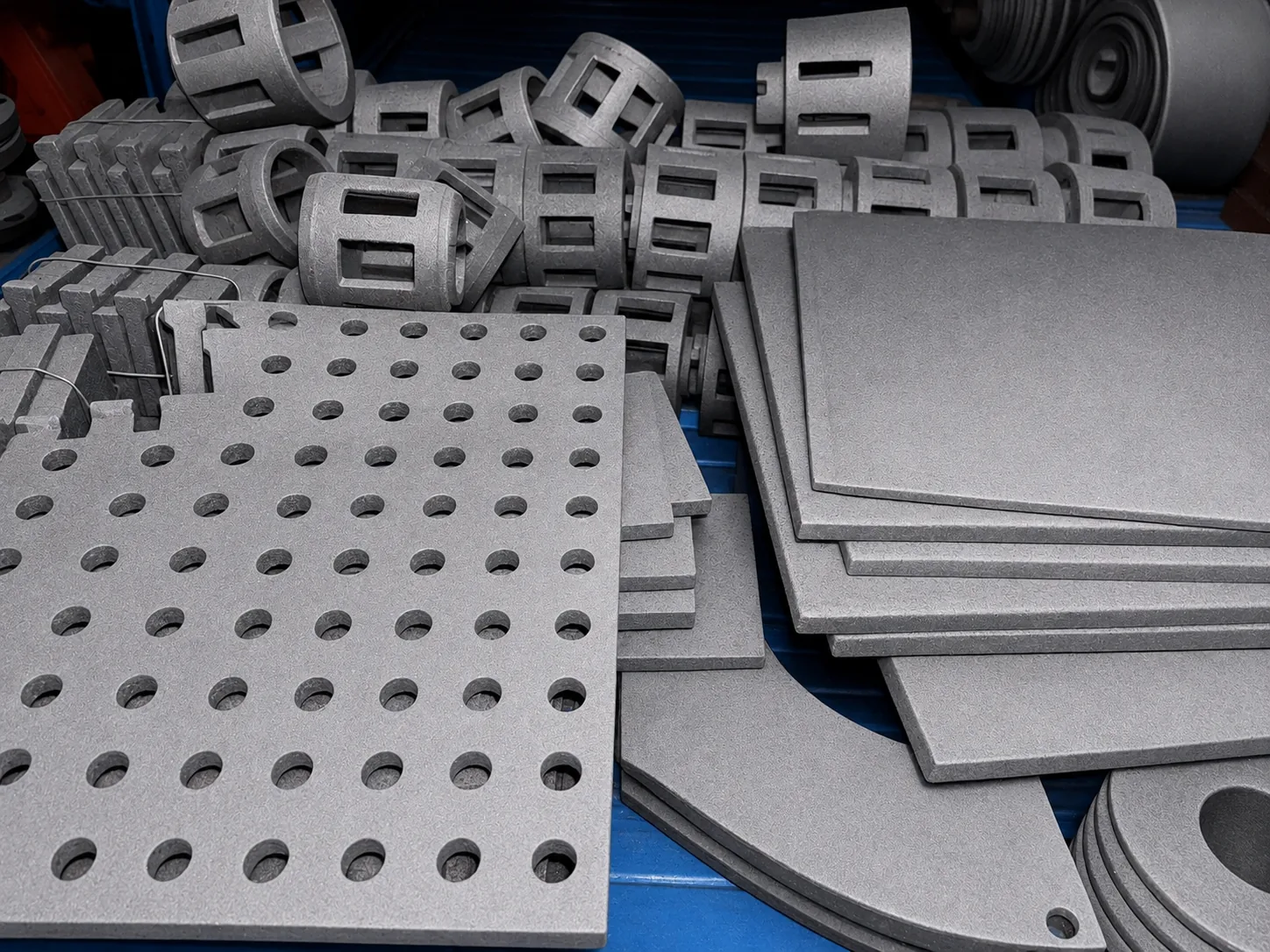 Finished shot blasting wear parts and cast replacement components for quality review