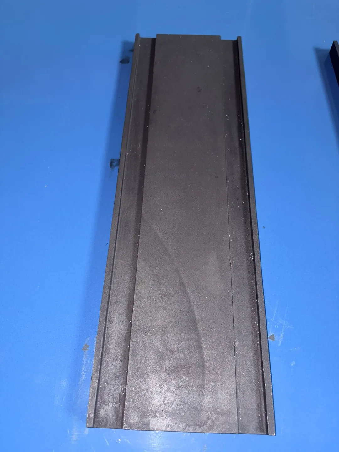Individual shot blasting wear part photographed for RFQ identification