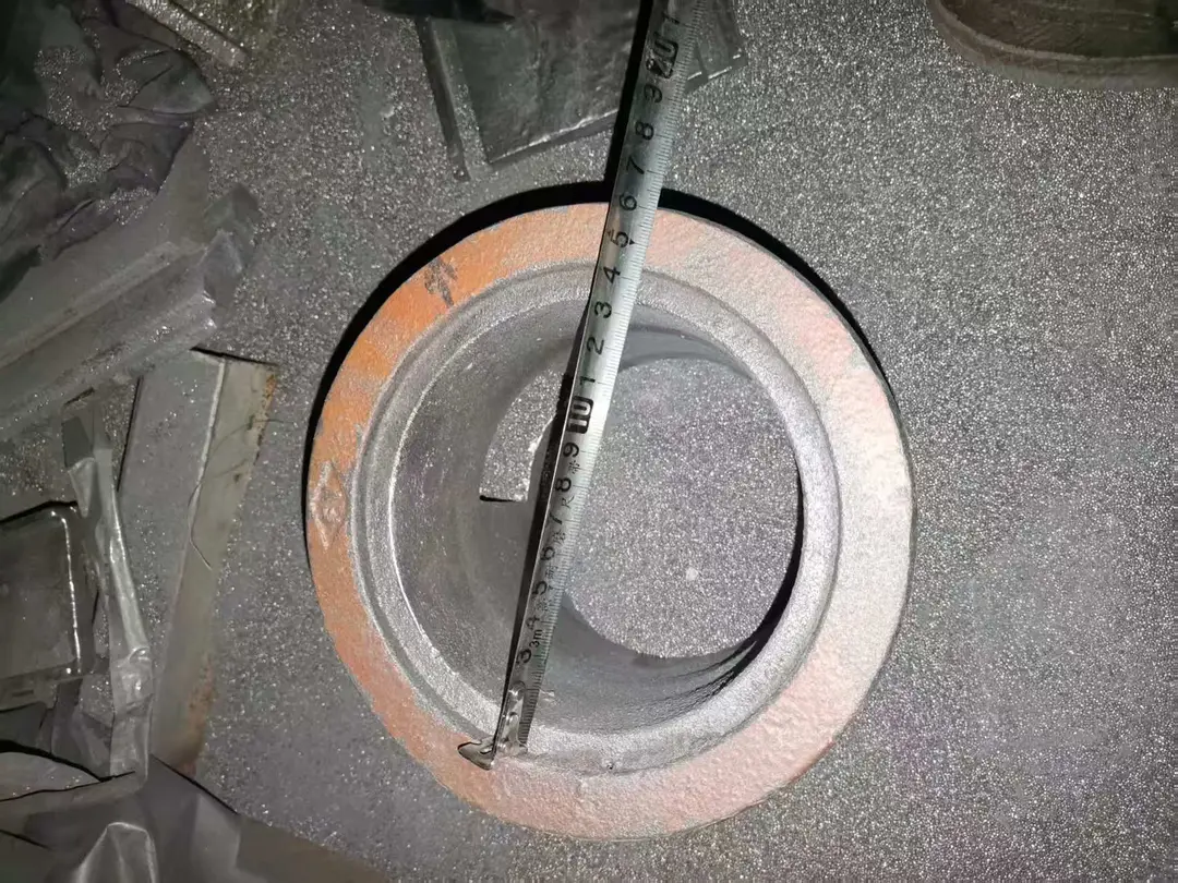 Shot blast control cage diagonal top view with tape showing flange and inner-opening measurement reference