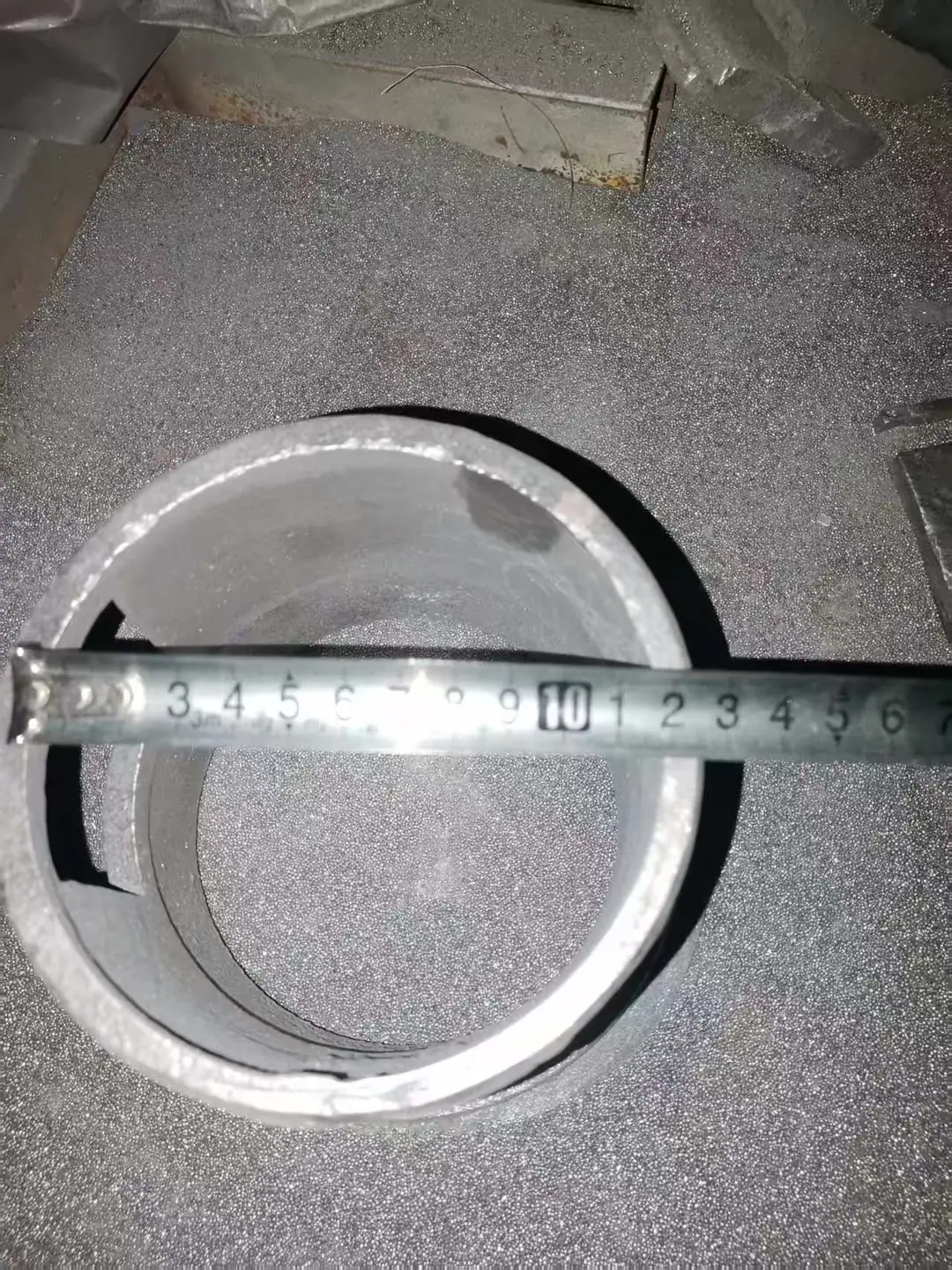Shot blast control cage inner opening measured with tape