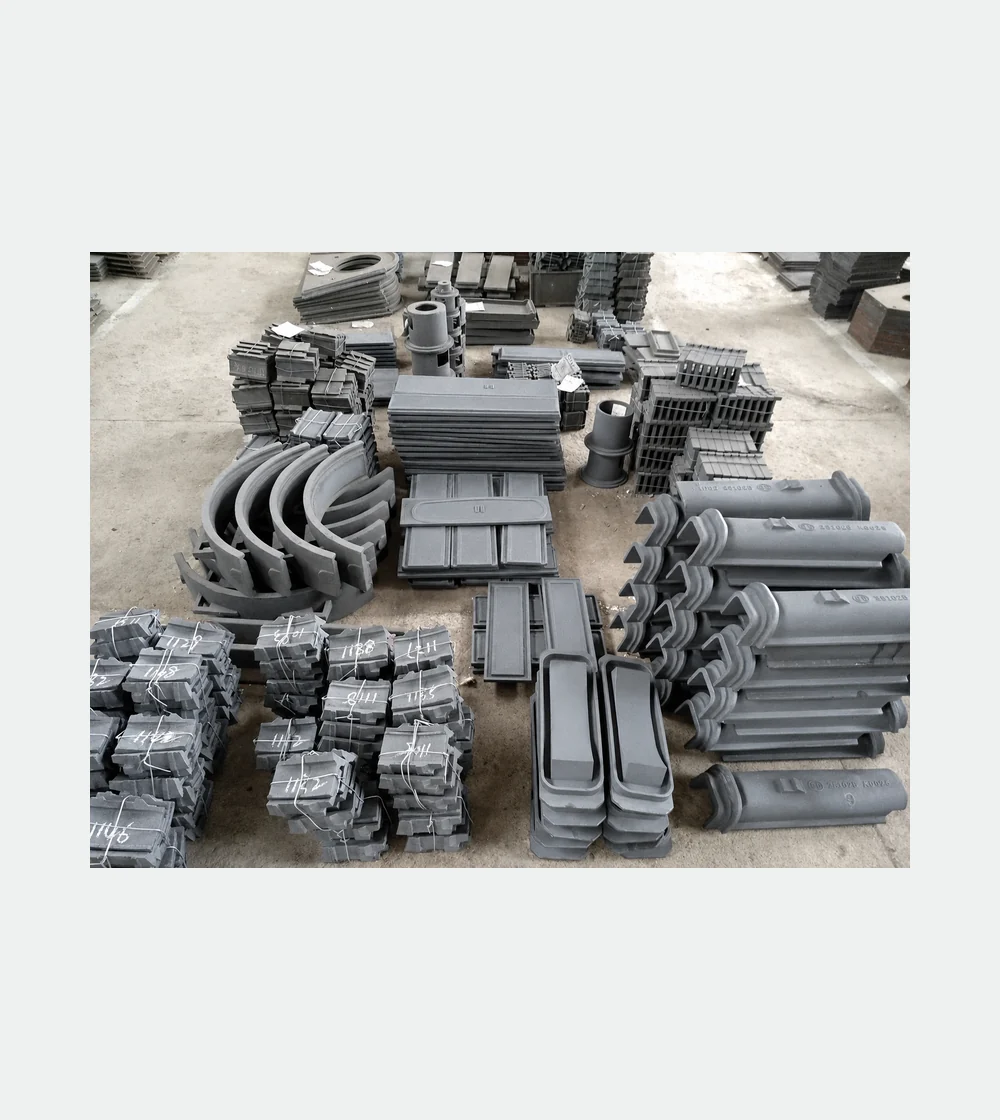 Several photographed replacement and wear components for shot blasting equipment