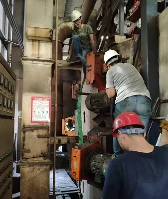 Fitment work documented at a blast wheel position on a chassis-frame shot blasting line
