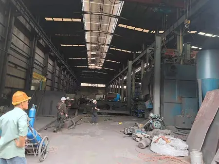 Original work area around hook-type shot blasting equipment before project work