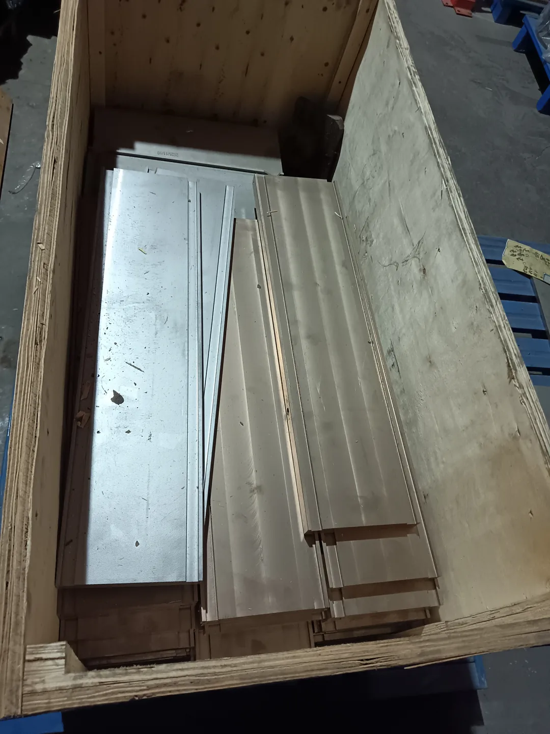 Tool-steel wear plates in a crate for quantity and replacement review